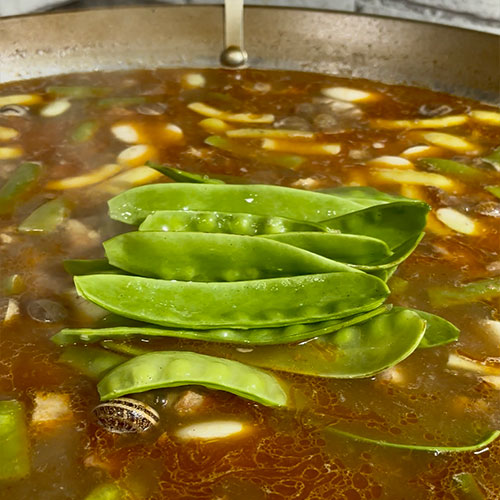 Add the snow peas and saffron