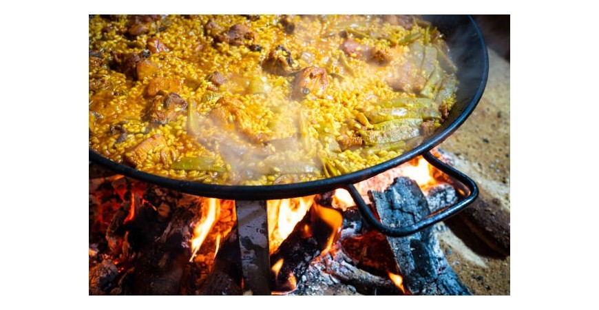 Is the paella covered when cooking?